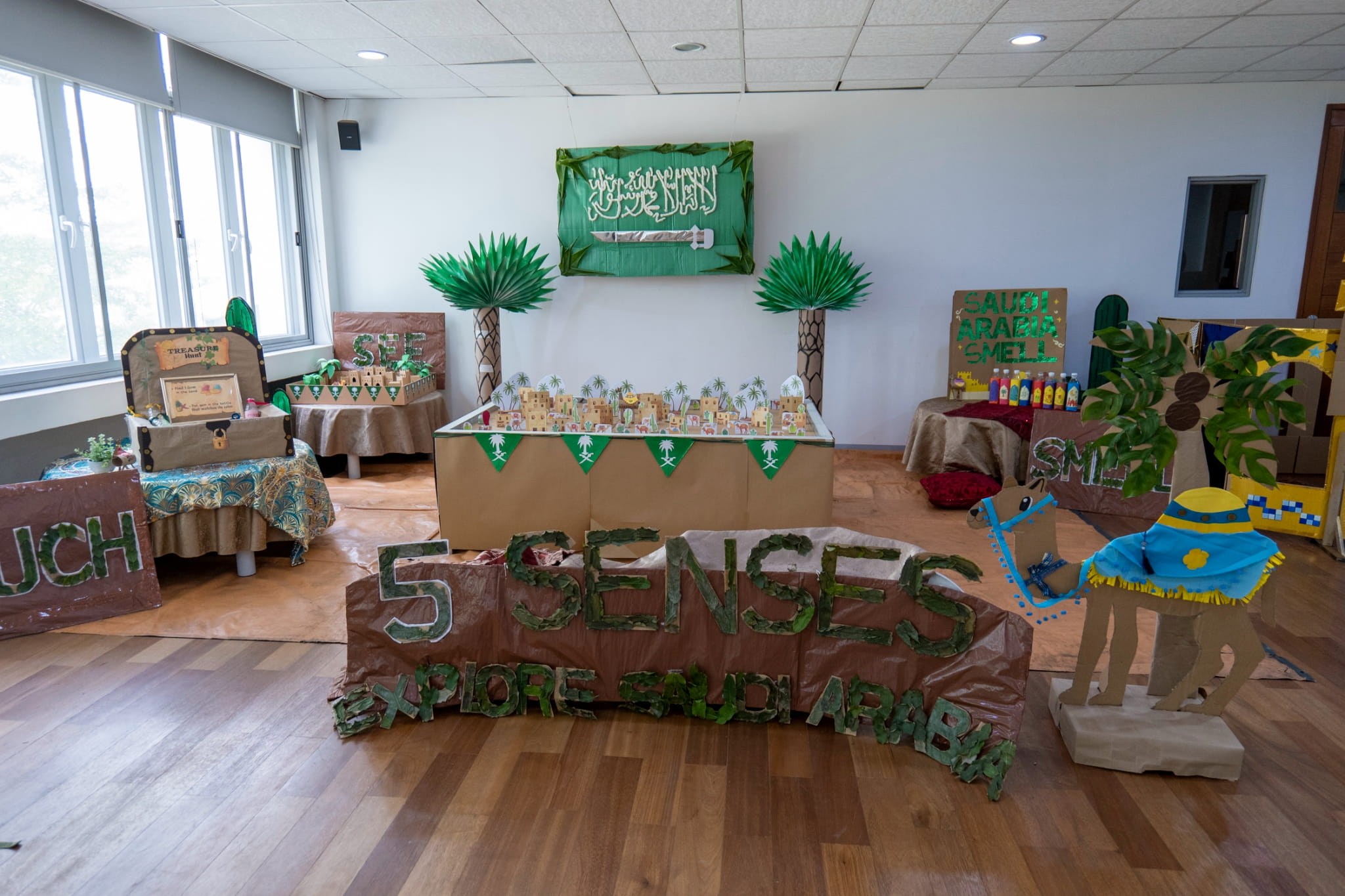 Saudi Arabia’s booth combines eco-friendly creativity with fun, sensory activities for the young learners to explore!