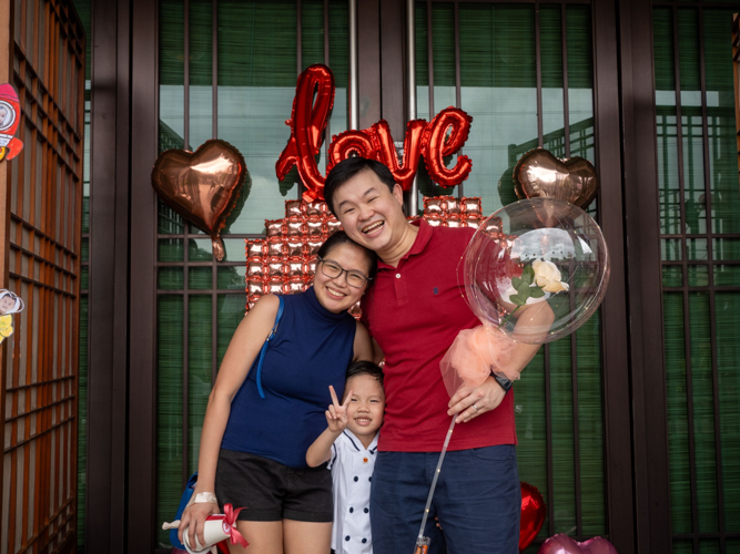 Families pose for photos at the kiddie market photo booth.