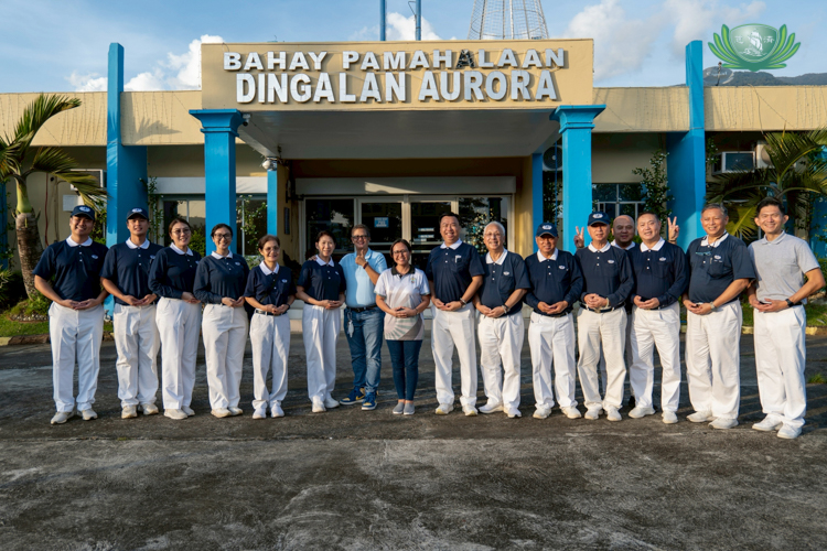 Tzu Chi volunteers pose with Mayor Aurora Taay for a photo after a successful ocular visit in Dingalan, Aurora.