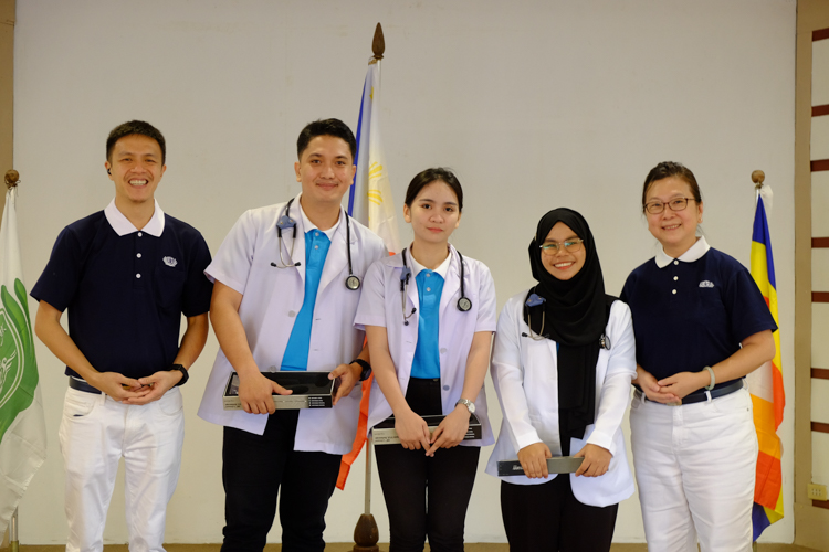 Medical scholars from Ateneo De Zamboanga University receive personalized stethoscopes in a symbolic moving-up ceremony.