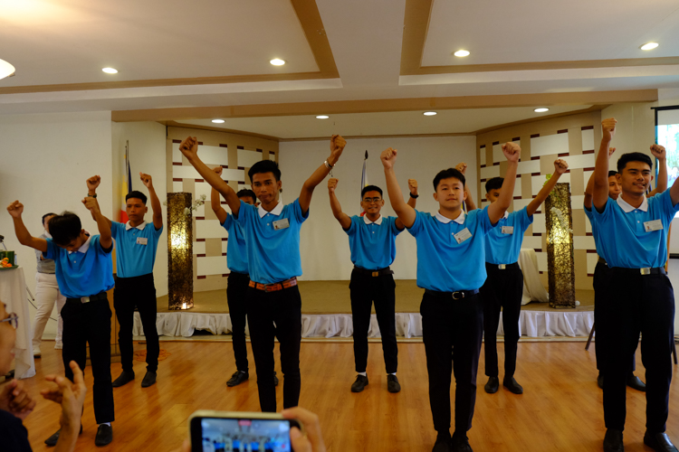 Pioneer Tzu Chi Zamboanga scholars confidently perform the One Family sign language song.