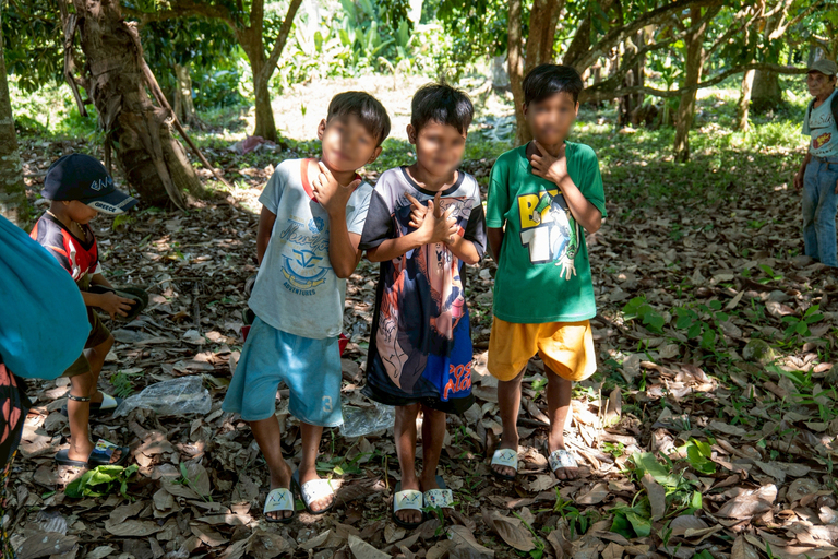 The children happily posed after receiving new sets of slippers.