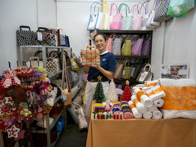 At the Jing Si Auditorium: Tzu Chi volunteer and staff of the Bureau of Corrections’ Correctional Institution for Women (CIW) in Mandaluyong, proudly shows the handmade products of the PDL Crafts & Display