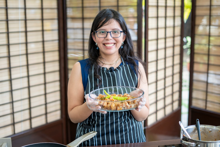 Recipe developer Camille Acosta presents the binagoongan pork belly she cooked using a plant-based meat from her brand The Good Choices.