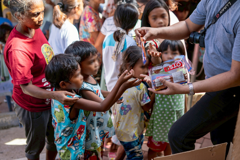 Free snacks were shared with everyone, as children eagerly got biscuits while waiting for their turn at the check-ups.