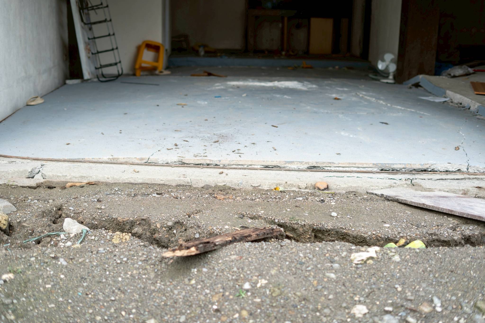 Numerous cracks on the road served as reminders of the recent quake. 