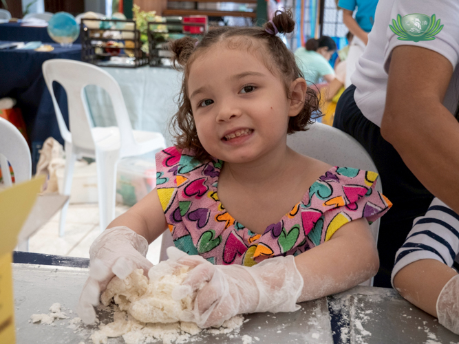 At the Unity Hall, a little girl participates in a soap-making workshop. 