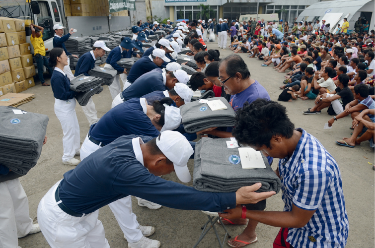 From “Remember Yolanda”: Tzu Chi blankets from Taiwan were distributed to Yolanda victims.