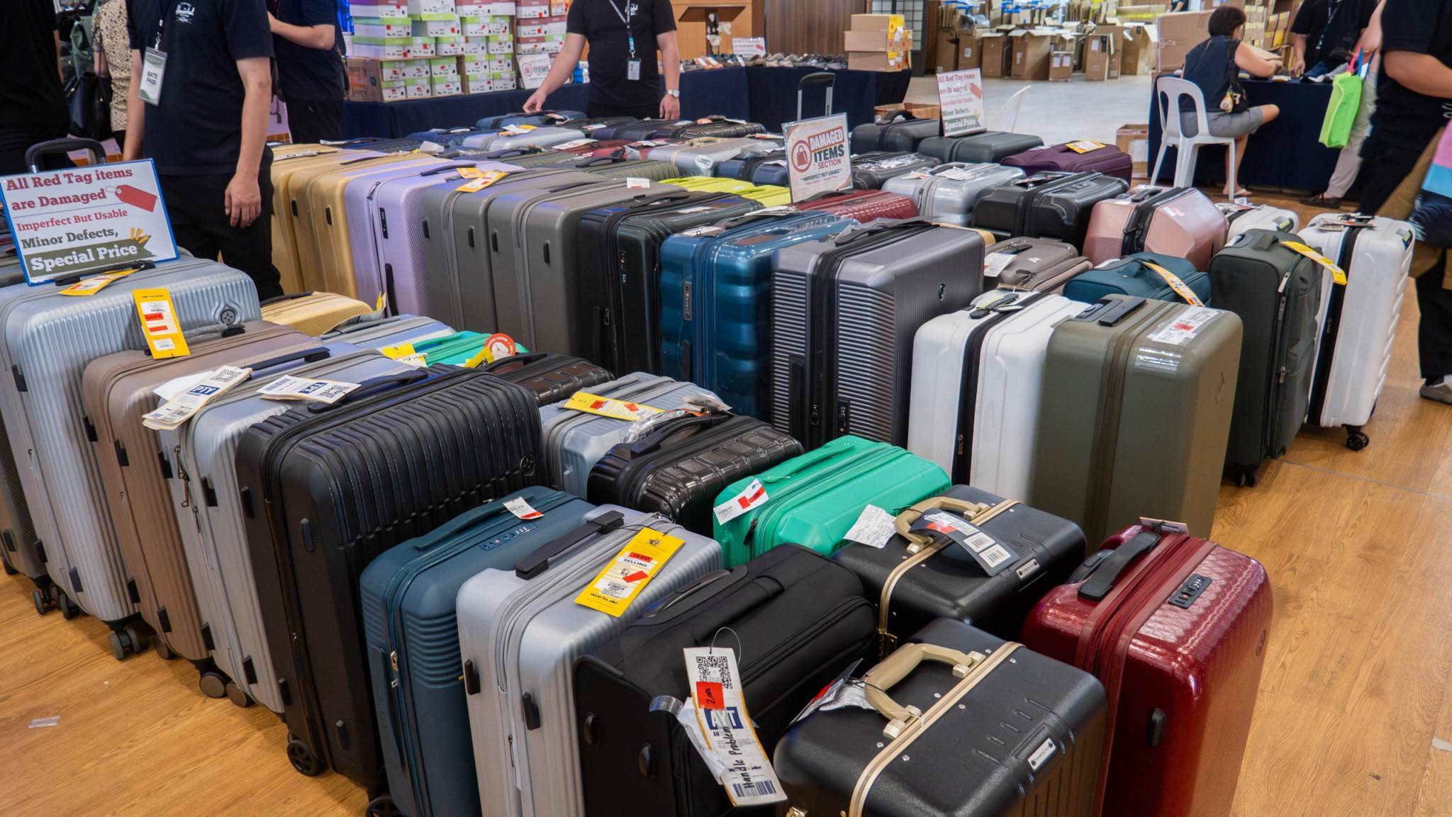 Assorted luggages in various sizes are arranged neatly on display for eager shoppers.