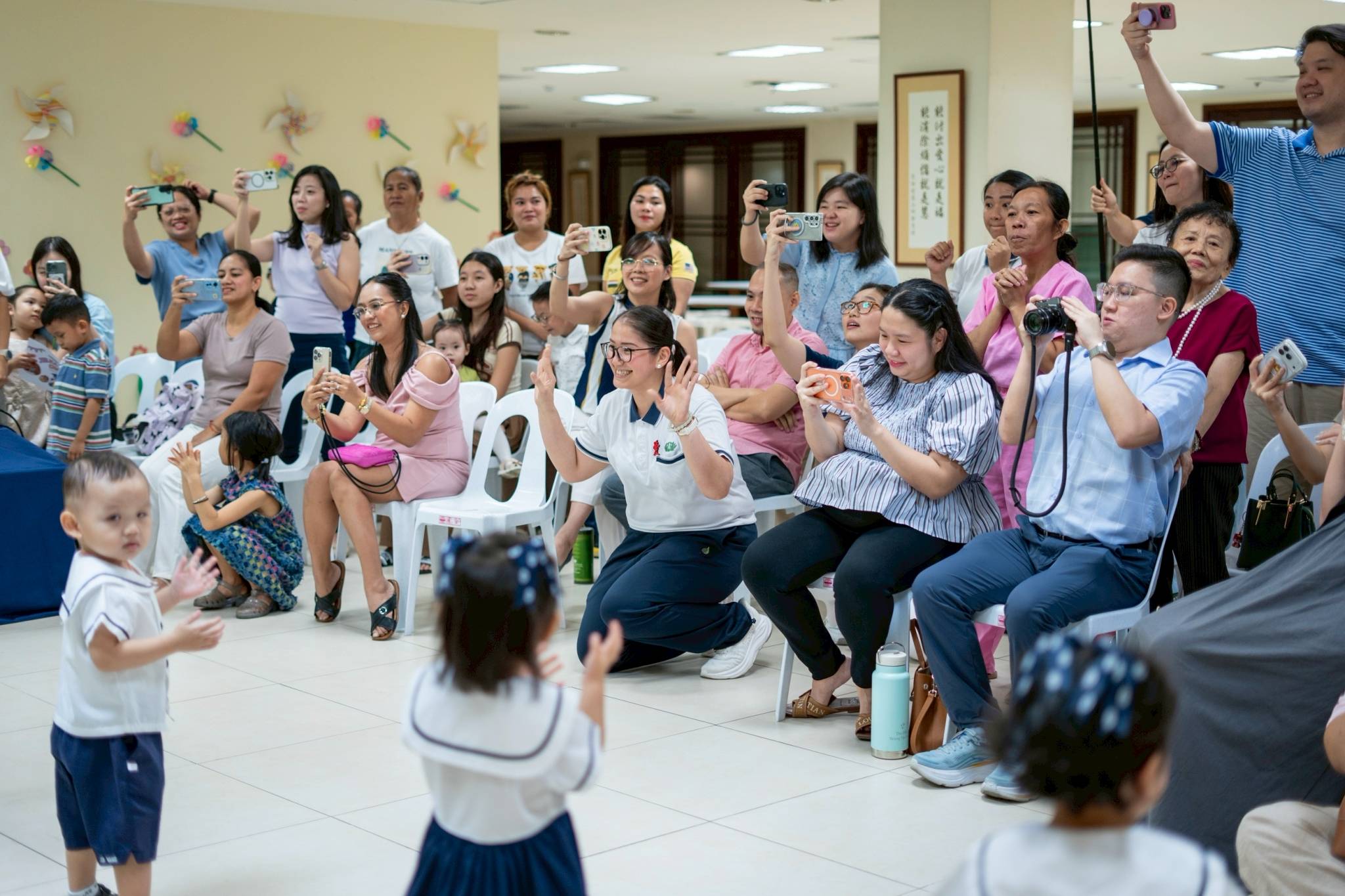 Cameras were everywhere as families captured every moment of the memorable celebration.