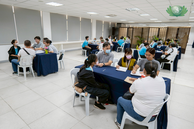 Volunteers worked in groups of three to interview scholars and their parents.