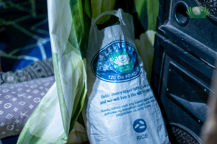 Many items from Tzu Chi, like this sack of rice, could be seen around Gerald Seciban’s home, all of which he received during his scholarship.