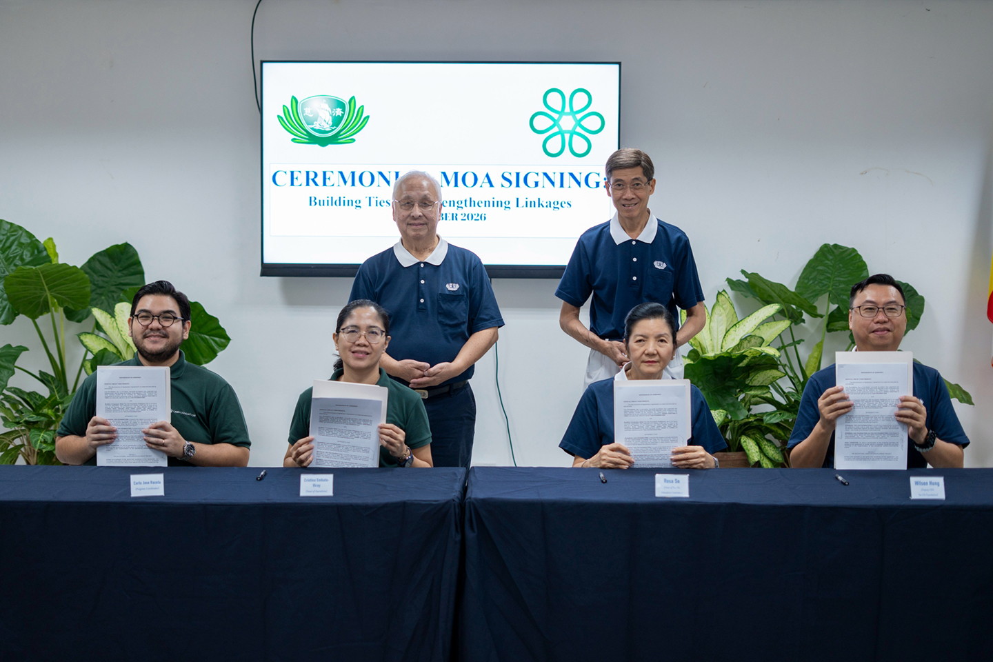 Tzu Chi and Lao Foundation representatives pose for a photo with the signed MOA. 