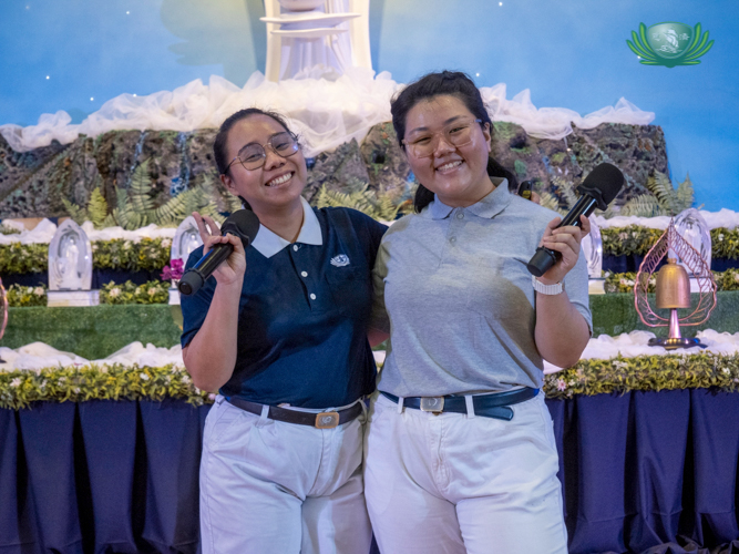 Tzu Chi volunteers Cherrie Rose Ang (left) and Nicolle Uy explain the fun and fulfilling side of volunteerism. 