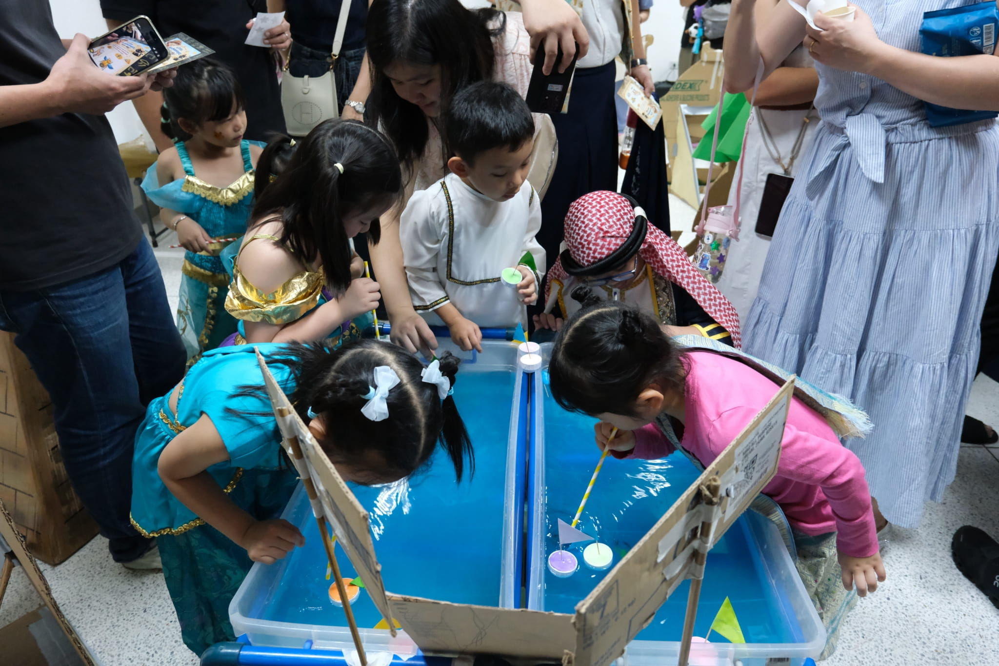 Young learners enjoy a boat-racing activity inspired by Egypt’s famous Nile River. 