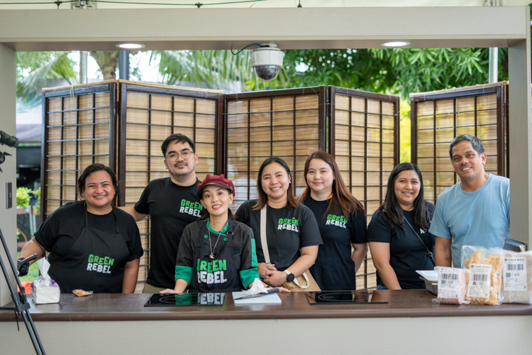 Camille Faustino (third from left) poses with her team after preparing hickory barbecue rybs, crispy fried spicy kung pao chicken, and premium patty sliders from Green Rebel, an Indonesian plant-based food company now available in the Philippines.