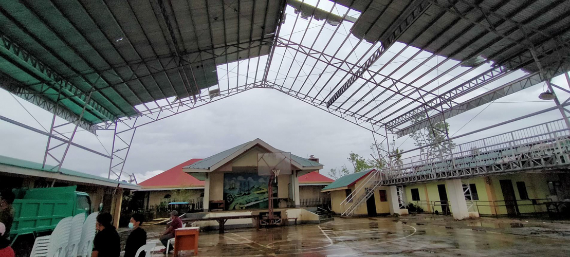 Odette’s powerful winds blew out the roofs of many homes and structures, including this covered court. 