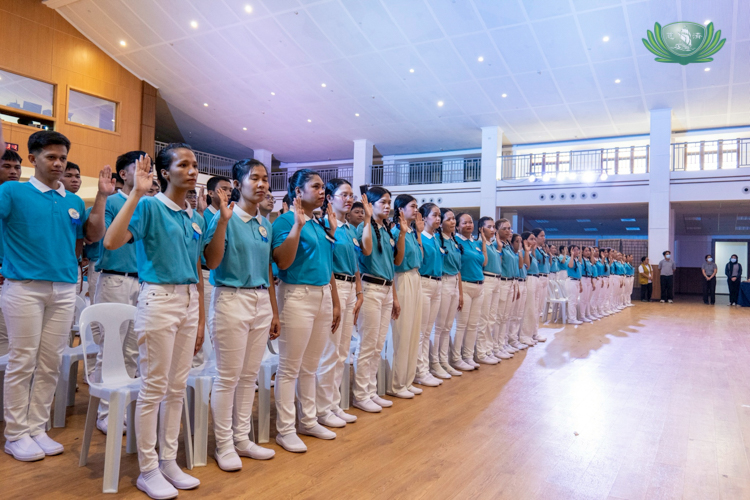 After a ceremonial graduation ceremony, scholars recite the  Alumni Pledge. 