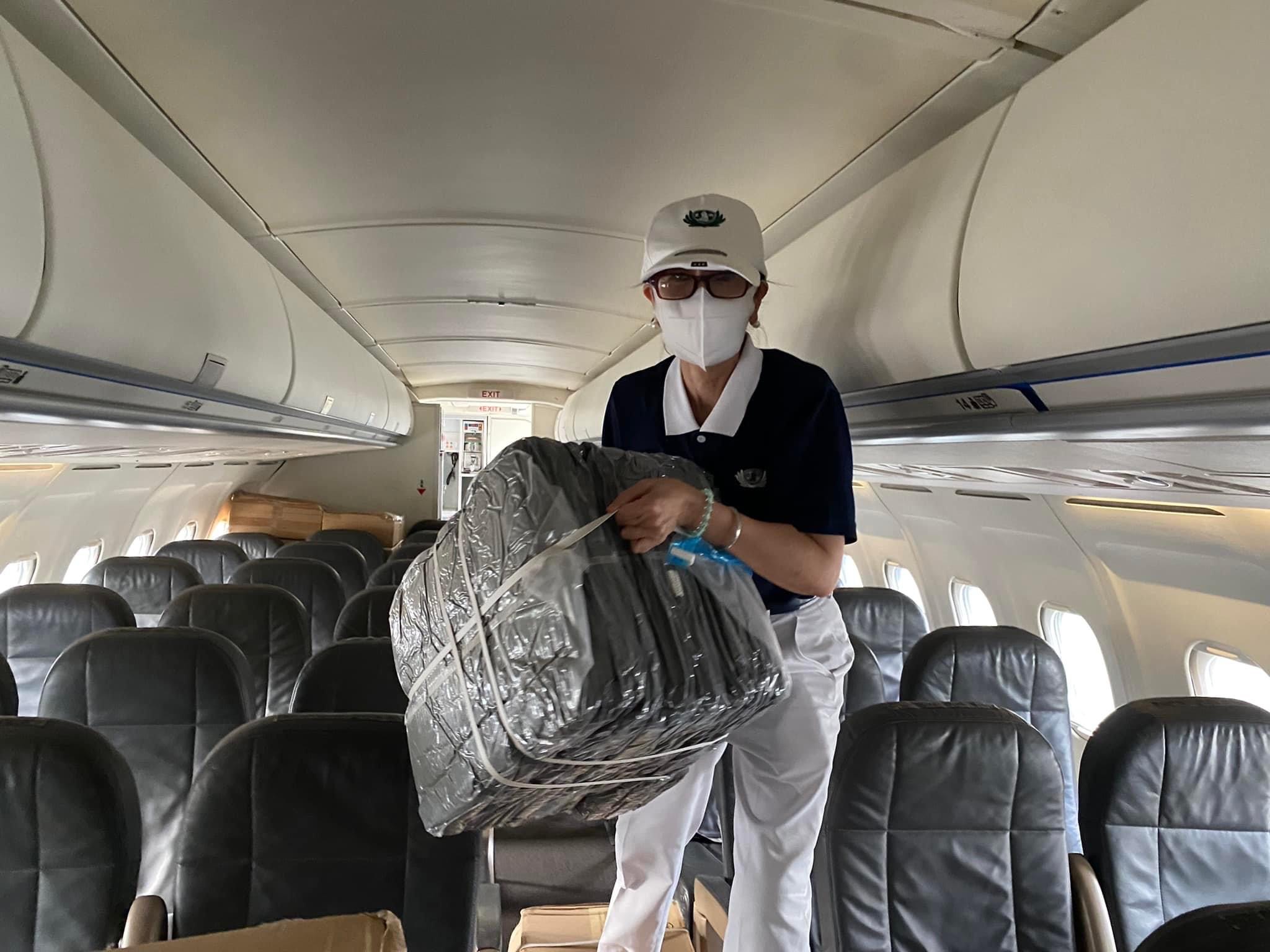 Loading the blankets into the plane begins.