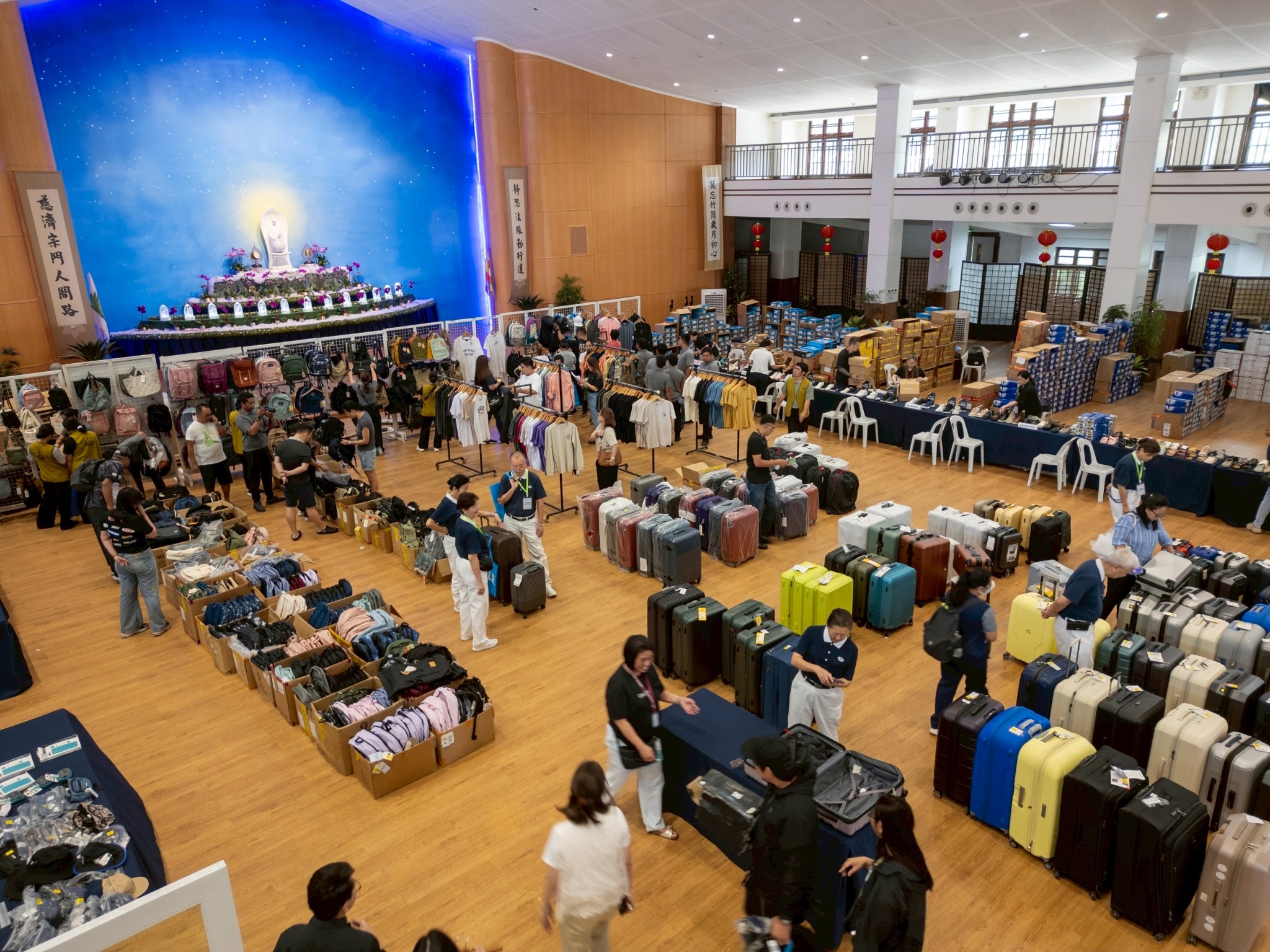 A bustling crowd explores various stalls at the Tzu Chi bazaar.