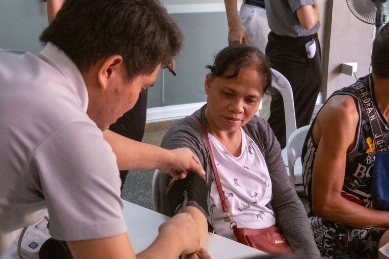 Patient Jocelyn Garcia gets her blood pressure checked before her tooth extraction.