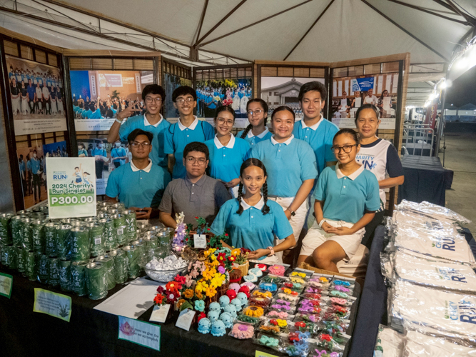 The scholars have a separate booth inside the Race Village where they sell artworks and charity run merchandise.