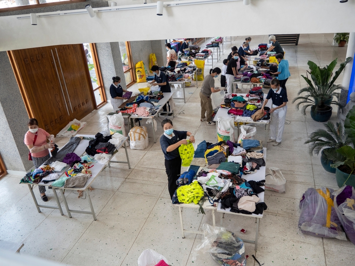 Volunteers met at Unity Hall in Buddhist Tzu Chi Campus to prepare bundles of donated clothes for distribution to communities affected by Typhoon Marce (Yinxing) in Aparri.