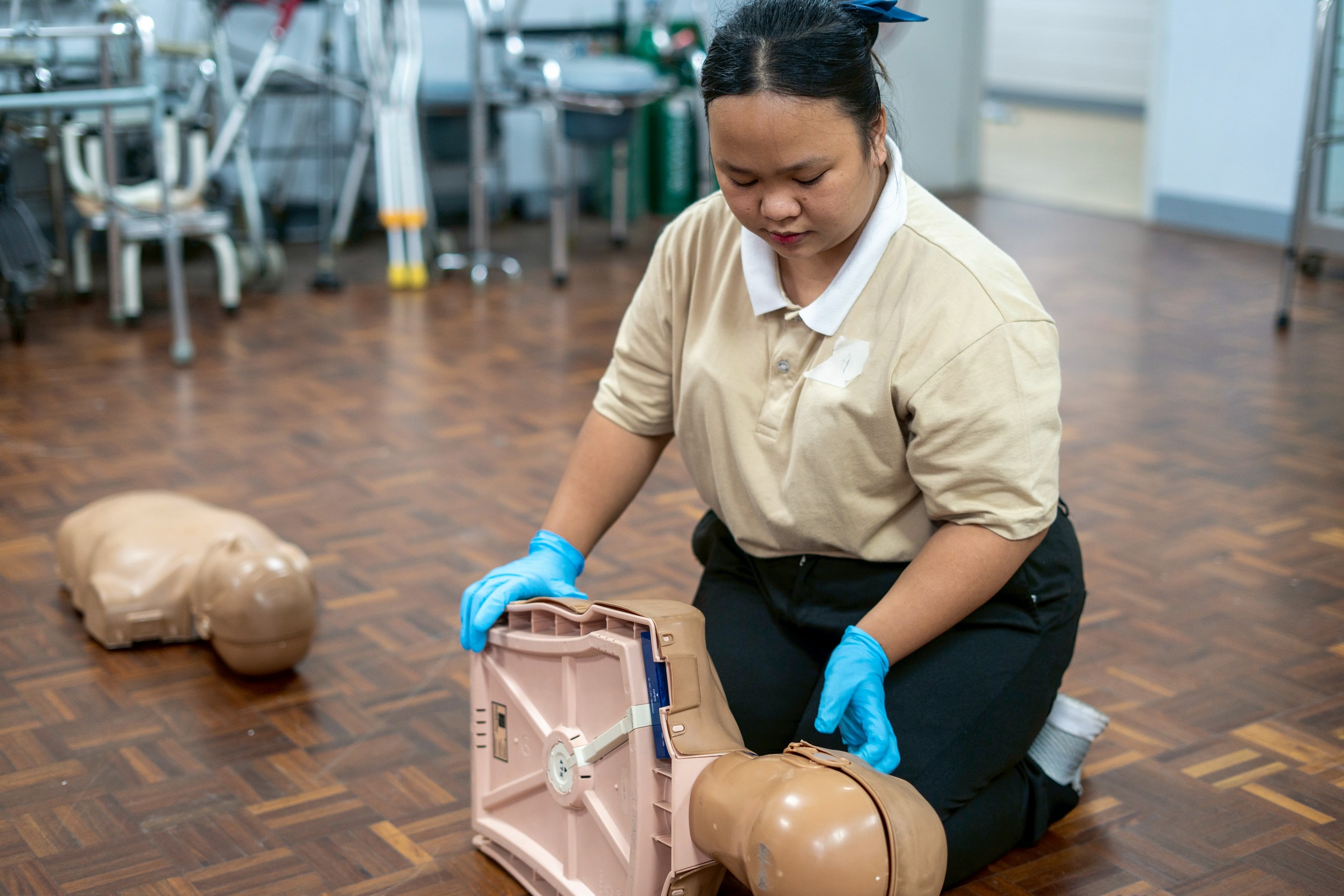 Gemmalyn confidently demonstrates first aid techniques as part of the caregiver scholars’ final demonstration.