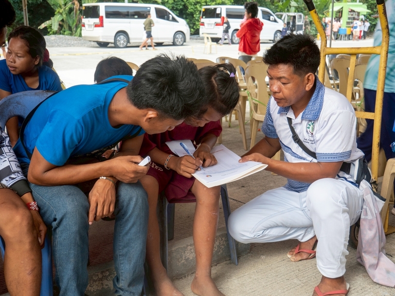 Upon arrival, the Mangyans were assisted with registration and guided through the process, with some volunteers offering support in writing. 