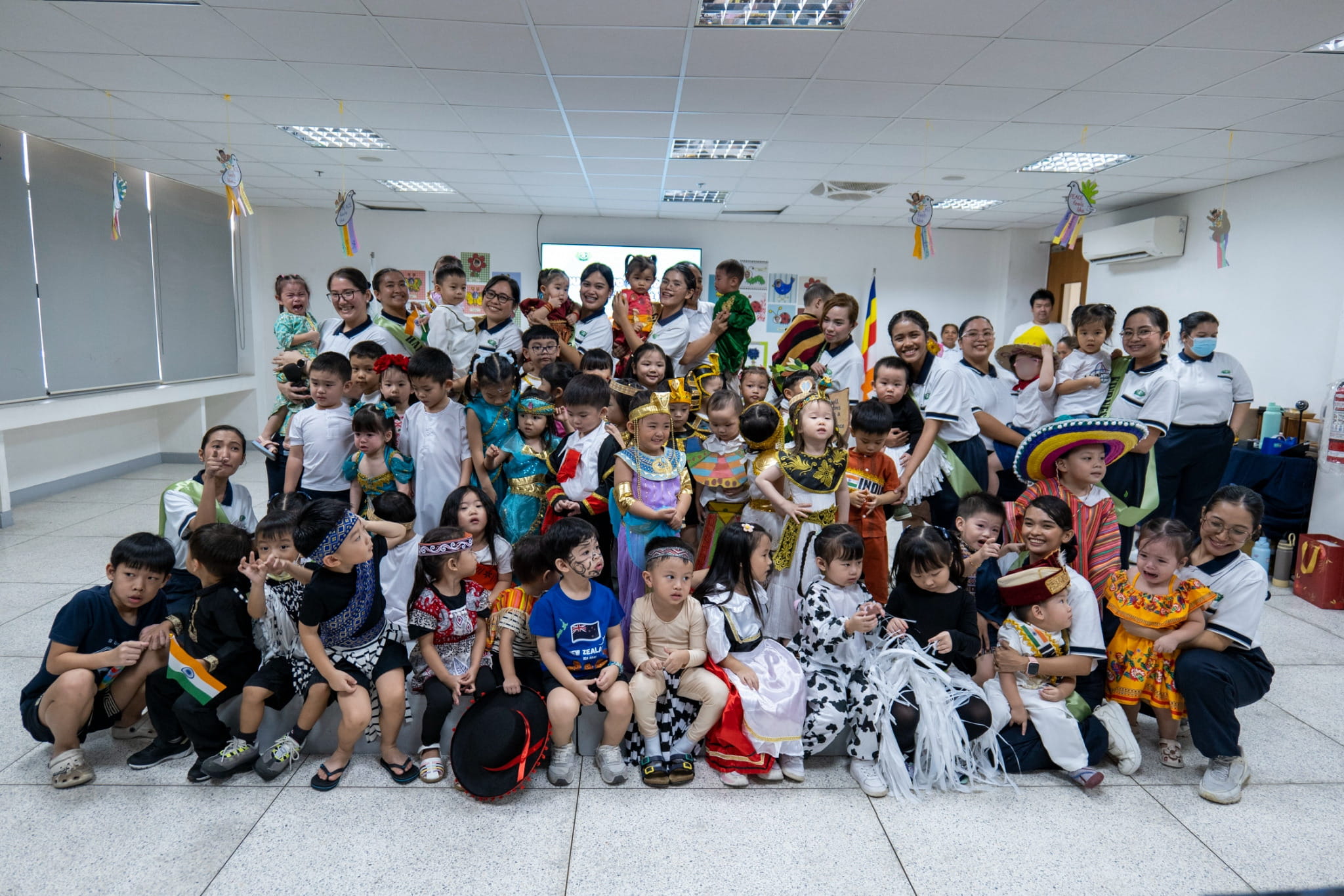 The learners of Tzu Chi Great Love Preschool Philippines pose together in their vibrant cultural costumes.