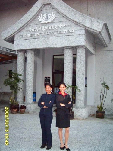 Jhoy and Jennie Sarmiento pose outside the Buddhist Tzu Chi Clinic