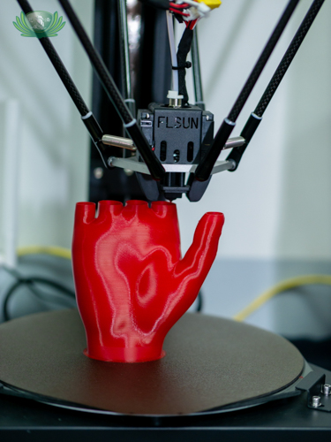 Filament is used to 3D-print a prosthetic hand. Depending on the size of a body part, it can take up to five hours to create a 3D print.【Photo by Daniel Lazar】
