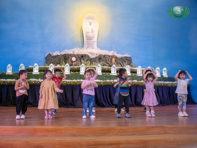 Preschoolers prepare a heartfelt performance to the song “Blessed to Have You.”