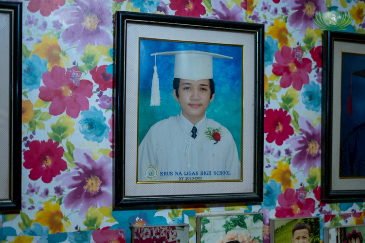 James Llenos’ graduation photo is proudly displayed in his home.