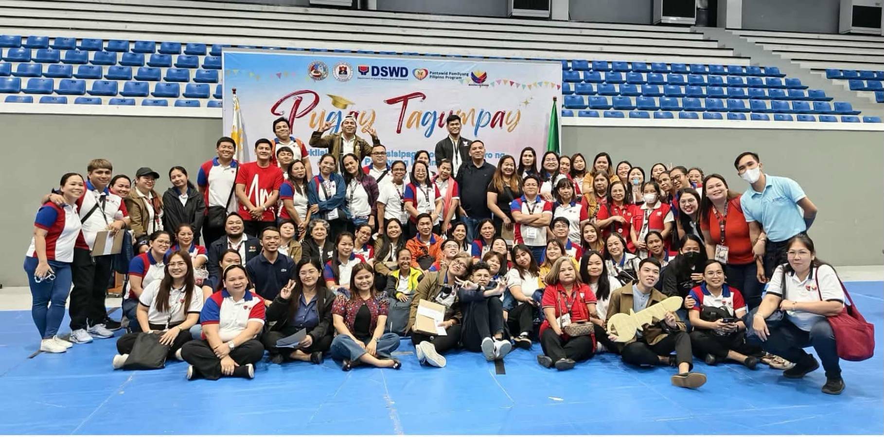 (First row, left) With colleagues at DSWD’s Pugay Tagumpay, a ceremonial graduation for families exiting the Pantawid Pamilyang Pilipino Program or 4Ps