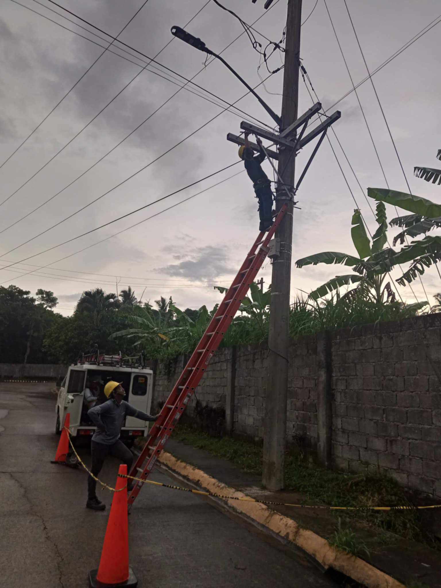 Gerald Seciban (below) working as an electrical lineman.
