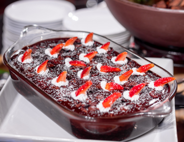 Chocolate pudding topped with sliced strawberry【Photo by Daniel Lazar】