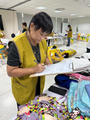 Marita Lestierre monitors the items on her station.