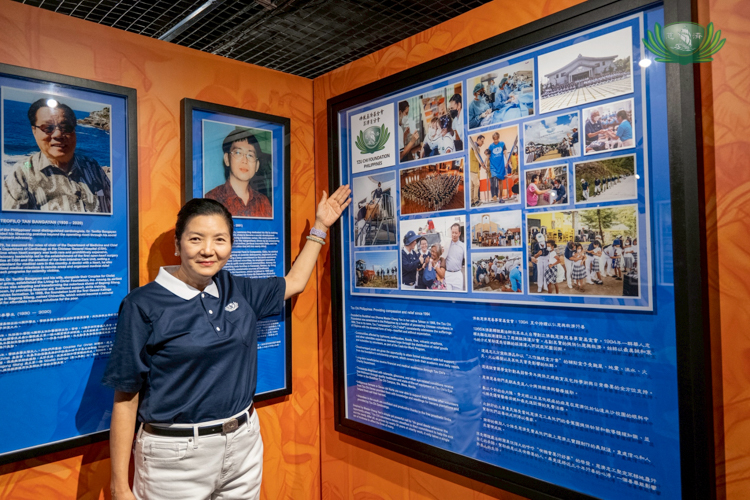 Tzu Chi Education Committee Head Rosa So poses next to a section in Bahay Tsinoy that recognizes the Tzu Chi Foundation’s contributions in Filipino society.