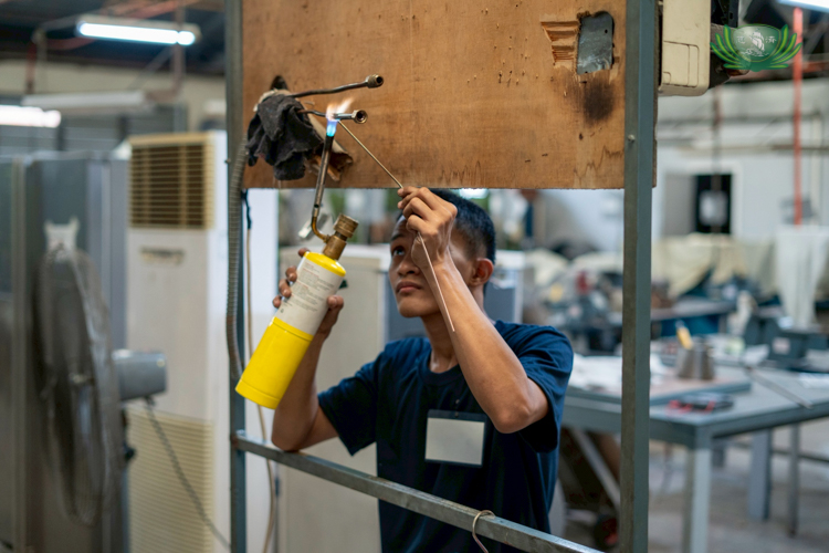 Through hands-on learning, Abdul Karim Madale builds skills he hopes will soon allow him to offer his services and start earning.