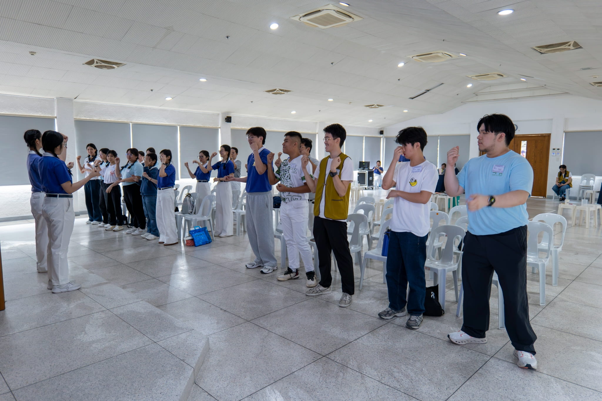 Learning how to sign the moves to the song “We Are Tzu Ching”