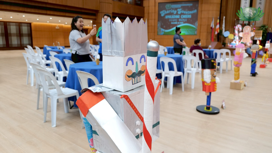Nutcrackers made by pre-kindergarten students were displayed along the red carpet aisle, complementing the Nutcracker-themed party. 