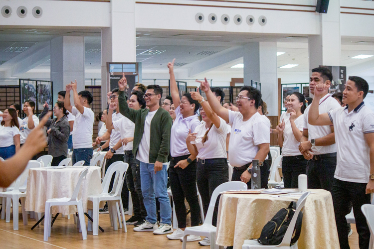 Scholar alumni join in the singing and dancing of the 2024 Scholars’ Camp song “Sail Your Story.”