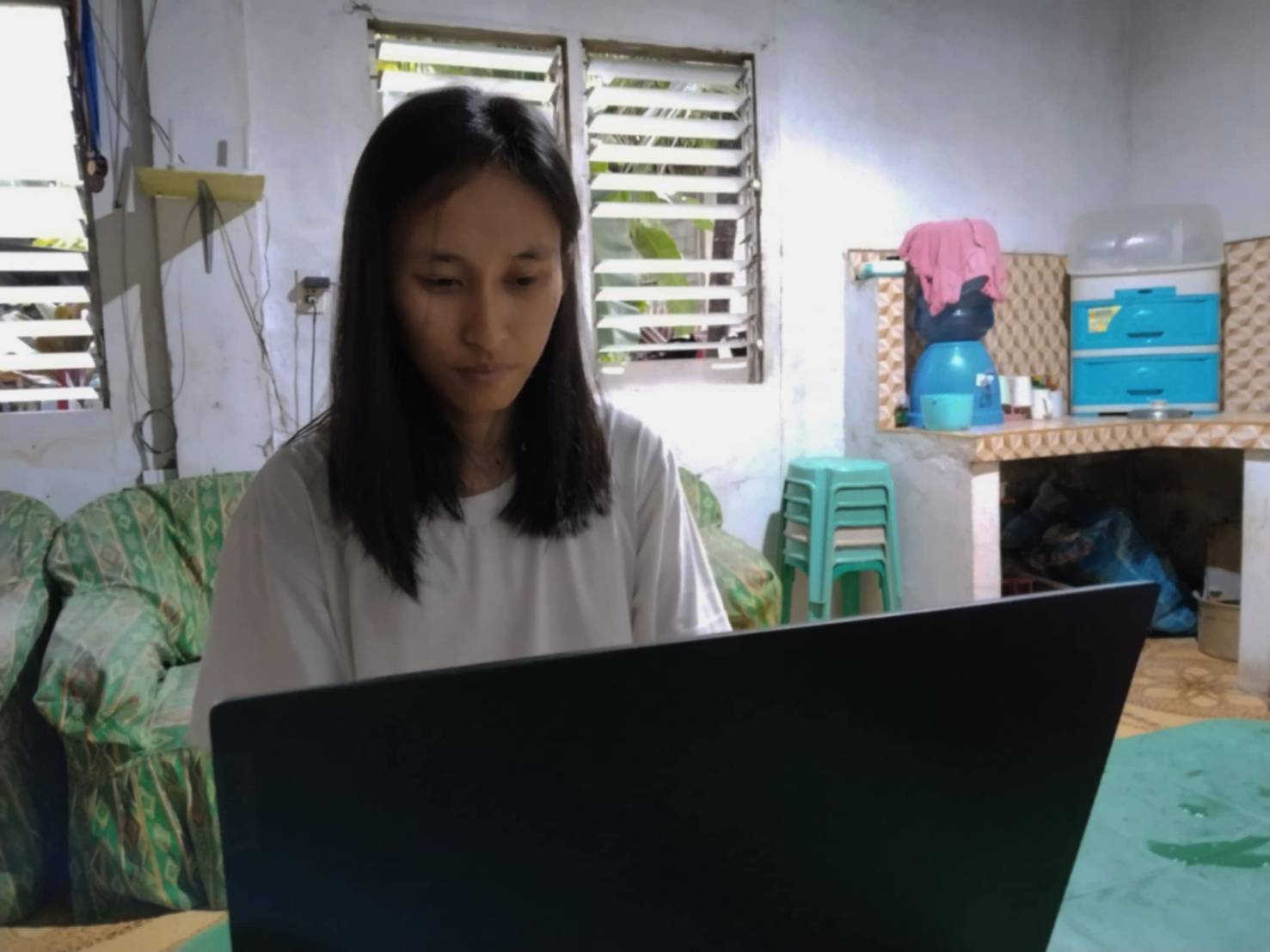One of four Tzu Chi Cebu scholars who volunteered to encode, Diane June Guinita encoded the names of beneficiaries who sought shelter at Justice Vicente Santiago Elementary School in San Mateo, Rizal