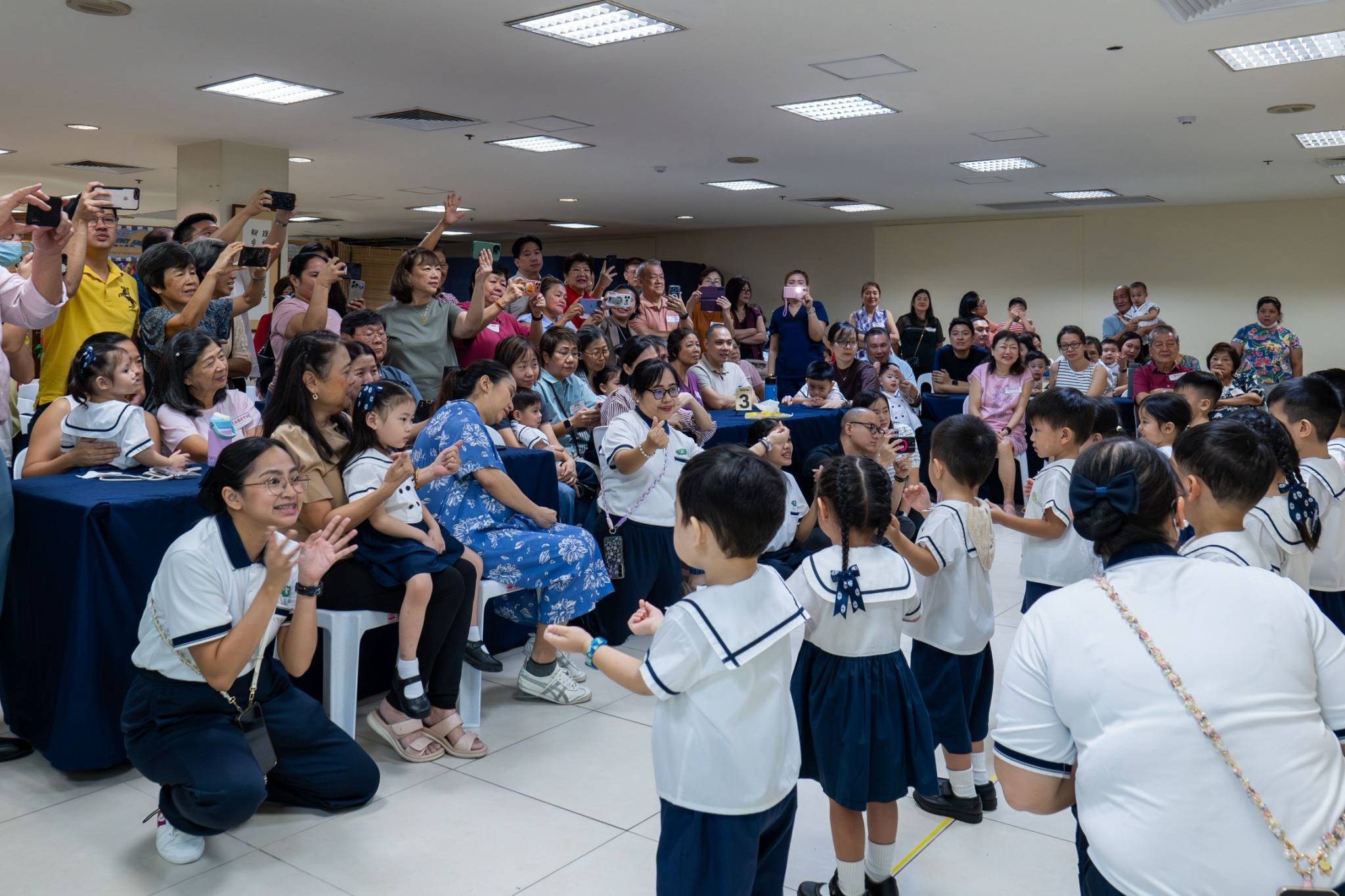 Everyone cheered as the young learners took the stage.