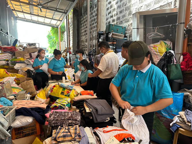 Scholars are also present in sorting donated goods.