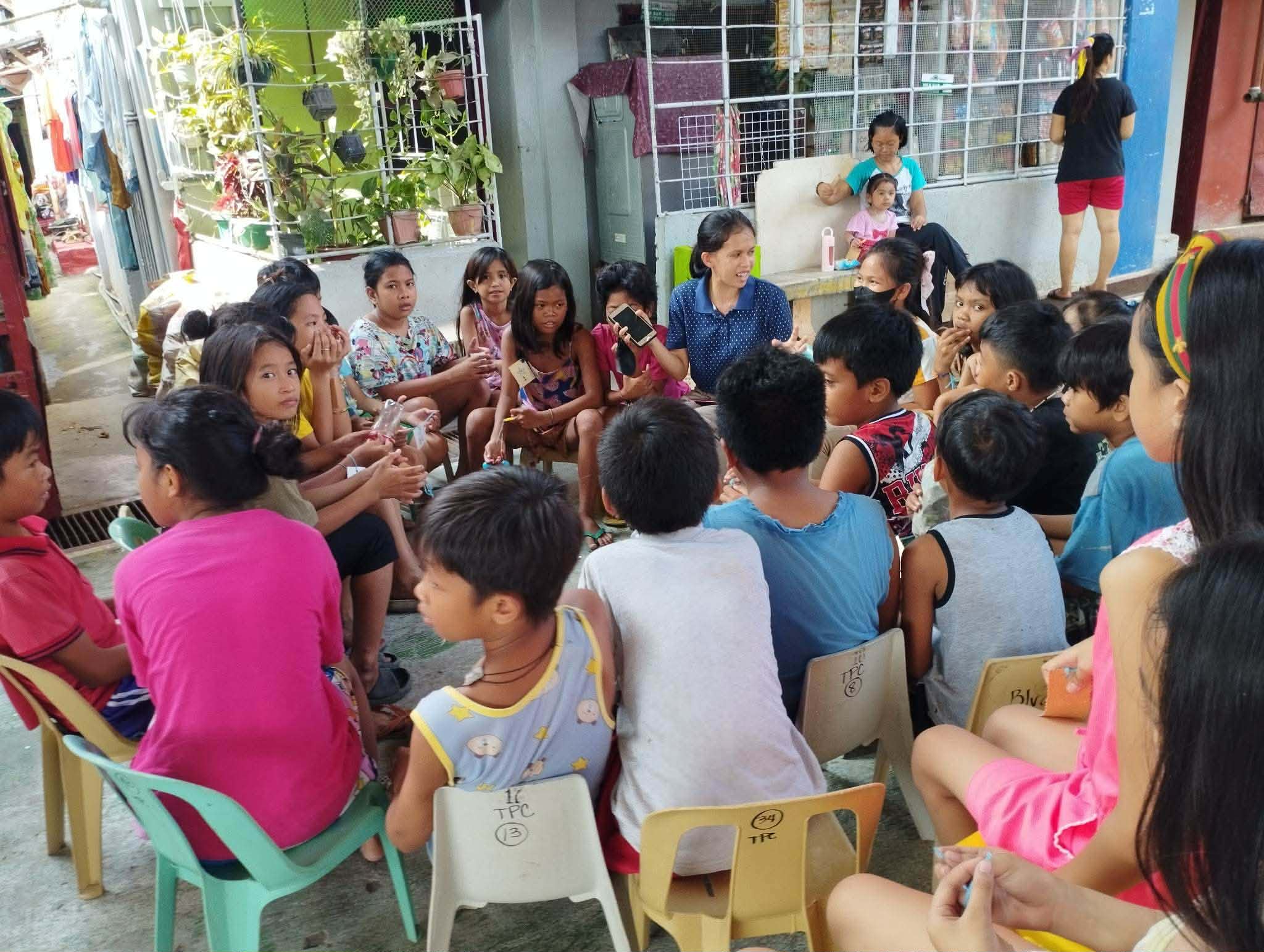 (In polka dots) Creating meaningful connections through a community outreach in Gravahan, Matina, Davao City / Photo courtesy of Mira Pondol