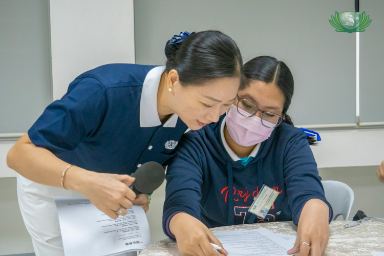 Faith Edrianne Manalastas practices reading the script for their activity.