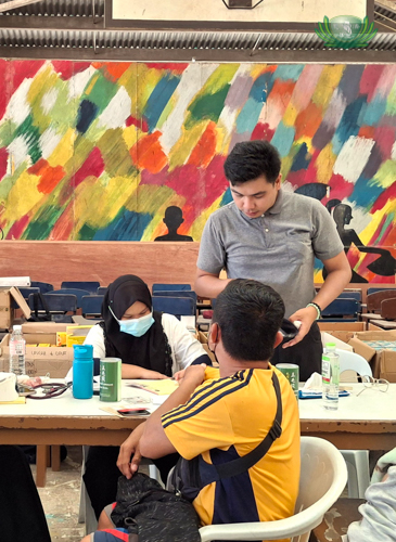 Former scholar and licensed Physician Dr. Rizma Uckung-Luy (left, seated) provides free medical consultations to beneficiaries.