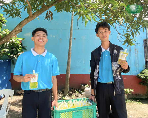 Scholars are all smiles as they sell their dishwashing soap.